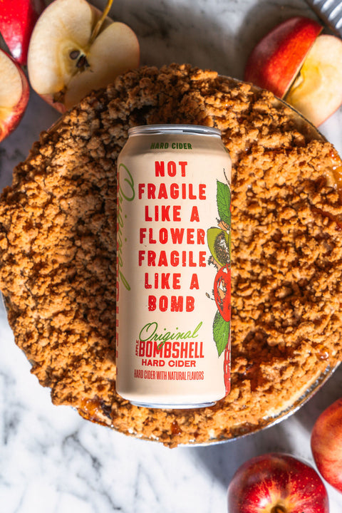 Can of Bombshell hard cider on a pie with apples around