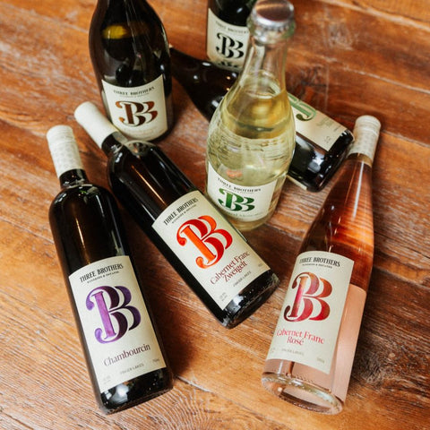 Bottles of red and white wines from Three Brothers Wineries