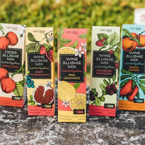 Boxes of Three Brothers Wineries wine slushie mix in Appleoosa, Berry Pomegranate, Pink Lemonade, Cranberry Raspberry, and Peach Mango